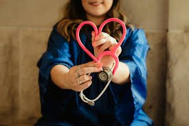 Nurse with heart stethoscope